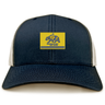 Berkeley RFC Retro Trucker Cap in navy blue with a snapback closure and a rectangular patch featuring a blue grizzly bear and “BERKELEY RFC est. 2004” on a yellow background.