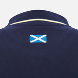 Close-up of the back of the Scotland SRU 26/27 Travel Polo by Macron in navy, featuring a small Scottish flag patch below the collar.