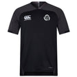 Missoula All-Maggots Vapodri Evader Jersey by EMB Canterbury: A black short-sleeved rugby jersey featuring a white EMB Canterbury logo on the right chest and a white circular Missoula All-Maggots emblem on the left chest. Designed with a subtle V-neck and crafted from moisture-wicking Vapodri fabric for comfort during intense play.