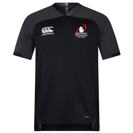 The Rugby Michigan Referee Society Vapodri Evader Jersey by EMB Canterbury, in black, features the Canterbury logo on the left chest and the "Rugby Michigan Referee" logo on the right chest. Designed with a VapoDri finish, it incorporates moisture-wicking technology to ensure you stay cool and comfortable.