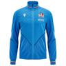 Blue Italy Rugby Travel Jacket 24/25 by Macron, with a zip-up design and a crest featuring three green leaves, a shield, and the word "Vittoria." It includes green, white, and red stripes on the collar and cuffs.