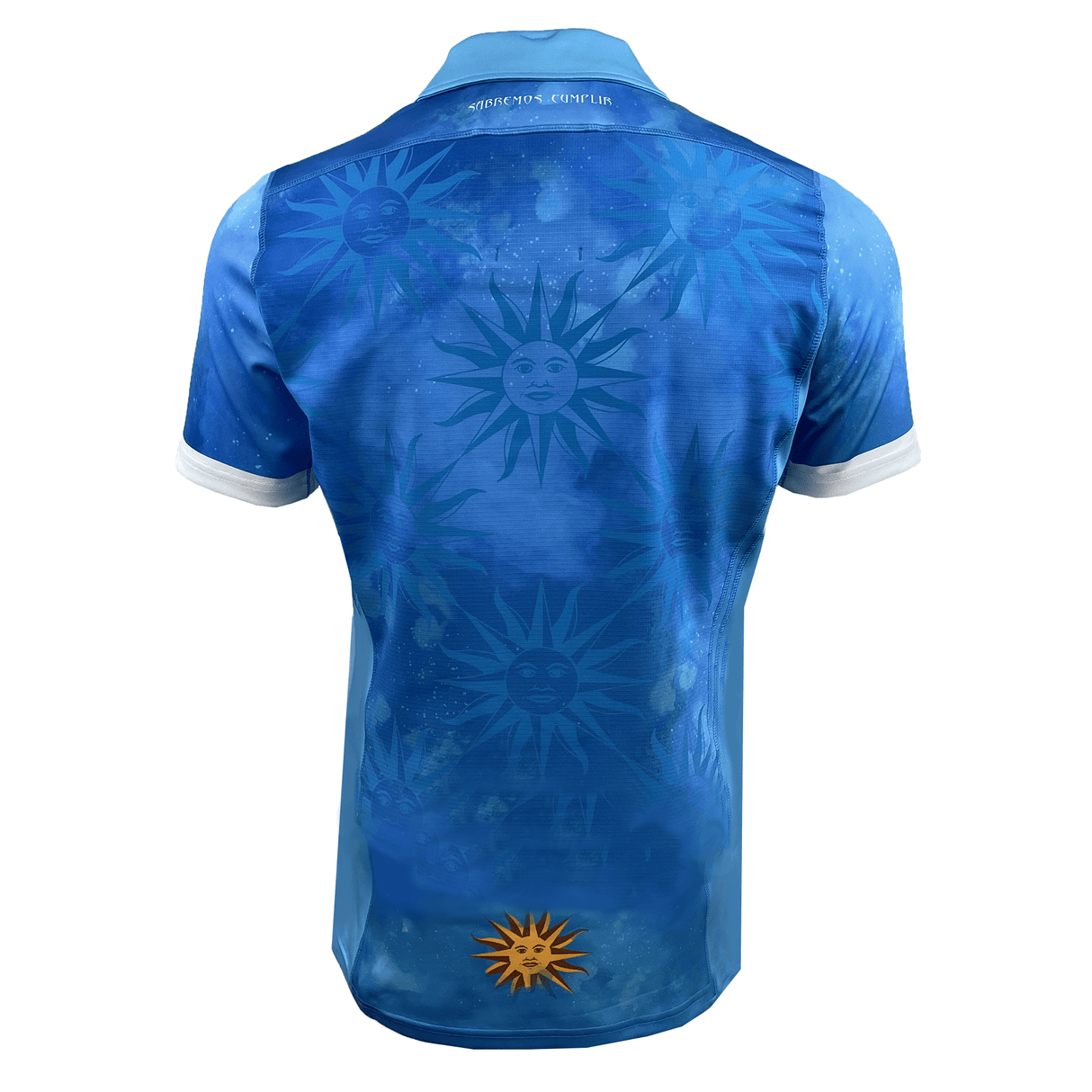 Back view of the Uruguay 24/25 Authentic Match Day Home Jersey by Macron, showcasing a blue polo shirt with a sun and face pattern on the back, complemented by a larger Sol de Mayo symbol near the bottom. The collar is white, embodying national pride reminiscent of an Uruguay Rugby Match Day Jersey.