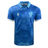 A Uruguay 24/25 Authentic Match Day Home Jersey by Macron, this blue short-sleeve soccer jersey boasts white accents, a patterned design of sun faces reminiscent of the Sol de Mayo, a bird crest with "URU," and the Macron logo.
