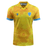 The Uruguay 24/25 Authentic Match Day Away Jersey by Macron is a yellow sports jersey with blue accents. It features a sun pattern and an emblem of a bird on the upper chest area, and is crafted from Eco-Armevo fabric for sustainable sportswear.