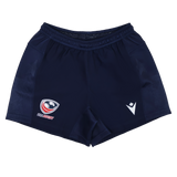The USA Rugby 24/25 Home Shorts by Macron feature a navy blue design, elastic waistband, stylized eagle head with "USA RUGBY" text, and white arrowhead—rugby performance shorts built for comfort in every match.
