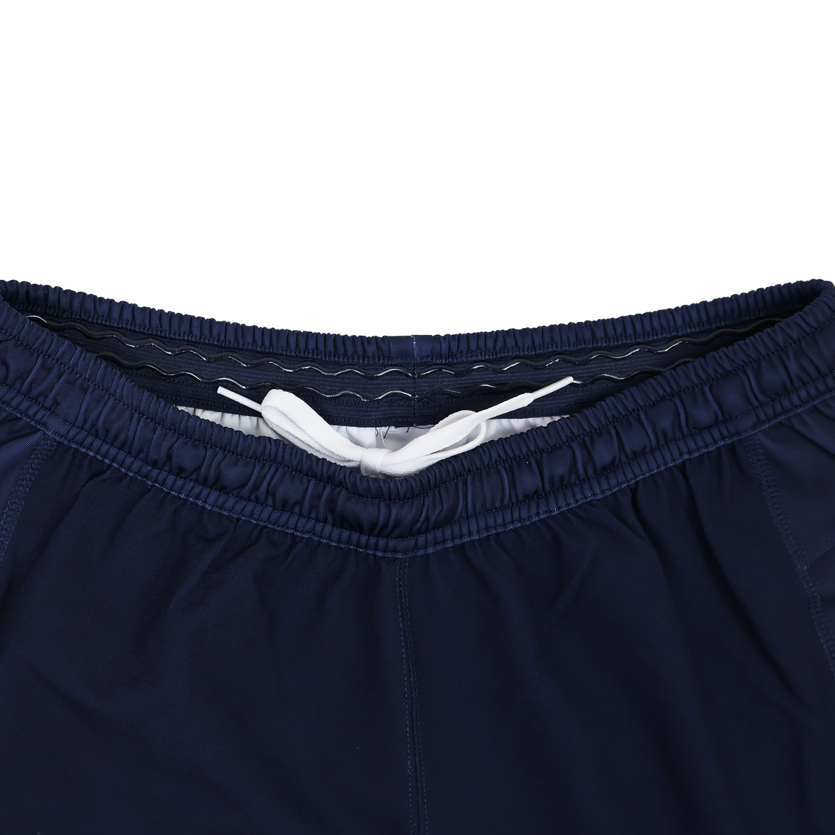 Close-up of the waistband on USA Rugby 24/25 Home Shorts by Macron in navy blue, featuring moisture-wicking fabric and a visible white drawstring.