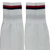 The USA Rugby 25 Matchday Away Socks by Macron are white crew socks with a red and navy blue stripe near the top, made from durable Renycle yarn for comfort and performance.