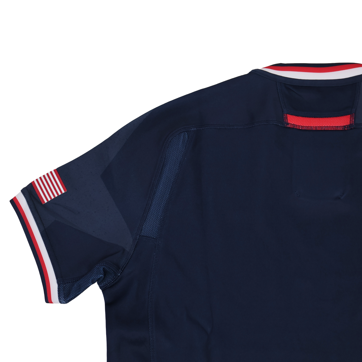 The Women's USA Rugby 24/25 Home Bodyfit Shirt by Macron features a navy blue design with red, white, and blue trim on the collar and sleeves plus a small American flag patch—perfect as an official rugby jersey.
