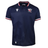 The USA Rugby 25/26 Replica Home Jersey by Macron features navy blue with subtle star patterns, red, white, and blue trim on the collar and sleeves, and the USA Rugby logo on the chest for authentic fan style.