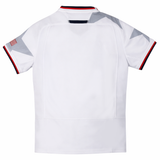 Back view of the Youth USA Rugby 24/25 Away Jersey by Macron, white with red, white, and blue trim, American flag sleeve patch, and gray star details on the shoulders.