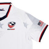 Youth USA Rugby 24/25 Away Jersey by Macron features an eagle logo, “USA RUGBY” text, American flag sleeve patch, red/white/blue trim, and subtle star patterns on the shoulder.