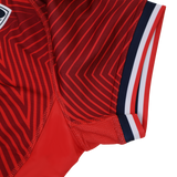 Close-up of the USA Rugby 24/25 Red Replica Training Jersey by Macron, showcasing diagonal stripes, mesh fabric detail, and navy, white, and red sleeve trim.