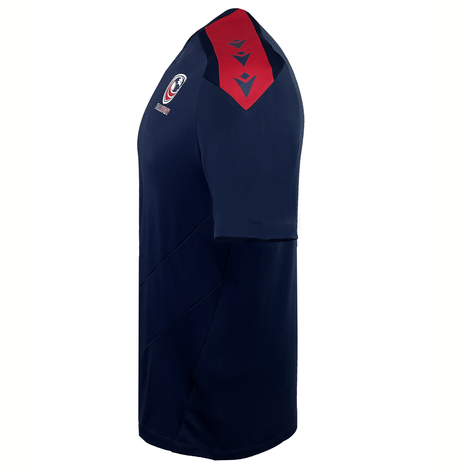 The USA Rugby 25 Player Training Shirt by Macron features navy blue MDry fabric, red shoulder accents, a chest logo, and diagonal side stitching—an ideal short-sleeve training top for USA Rugby fans.