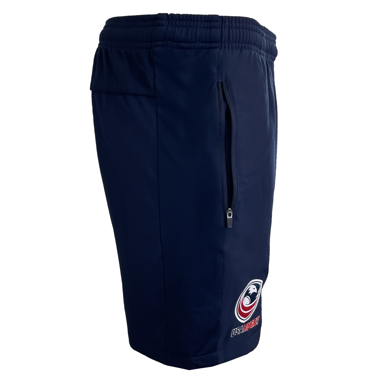 The USA Rugby 25 Player Training Shorts by Macron are navy blue with an elastic waistband, zippered side pocket, and a lower leg logo featuring a stylized eagle and "USA RUGBY" text.