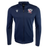 The USA Rugby 25 Travel 3D Full-Zip Top by Macron is a navy blue top with the USA Rugby 25 Travel logo on the left chest and a white Macron logo on the right.
