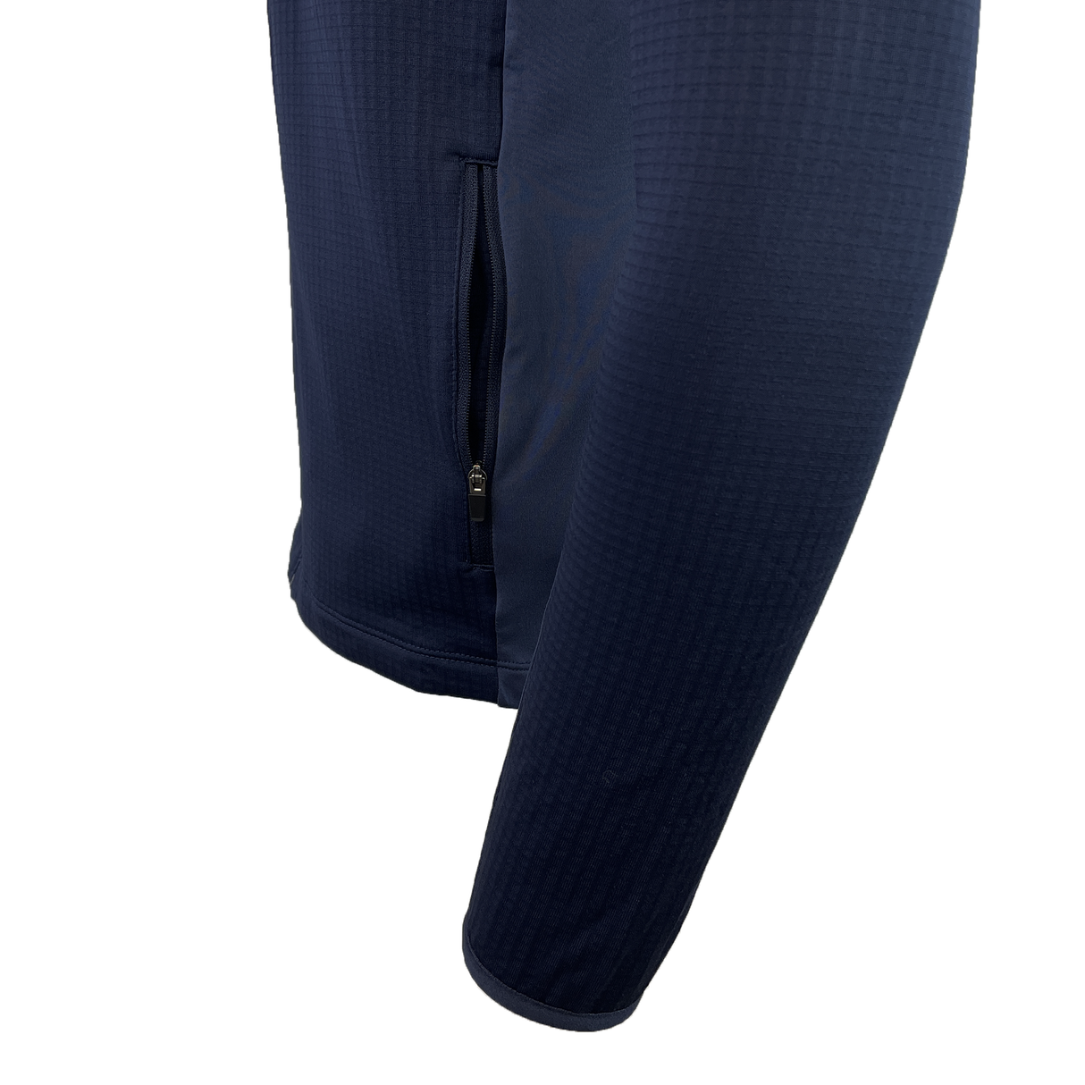 Close-up of the USA Rugby 25 Travel 3D Full-Zip Top by Macron in navy blue, featuring a zippered side pocket.