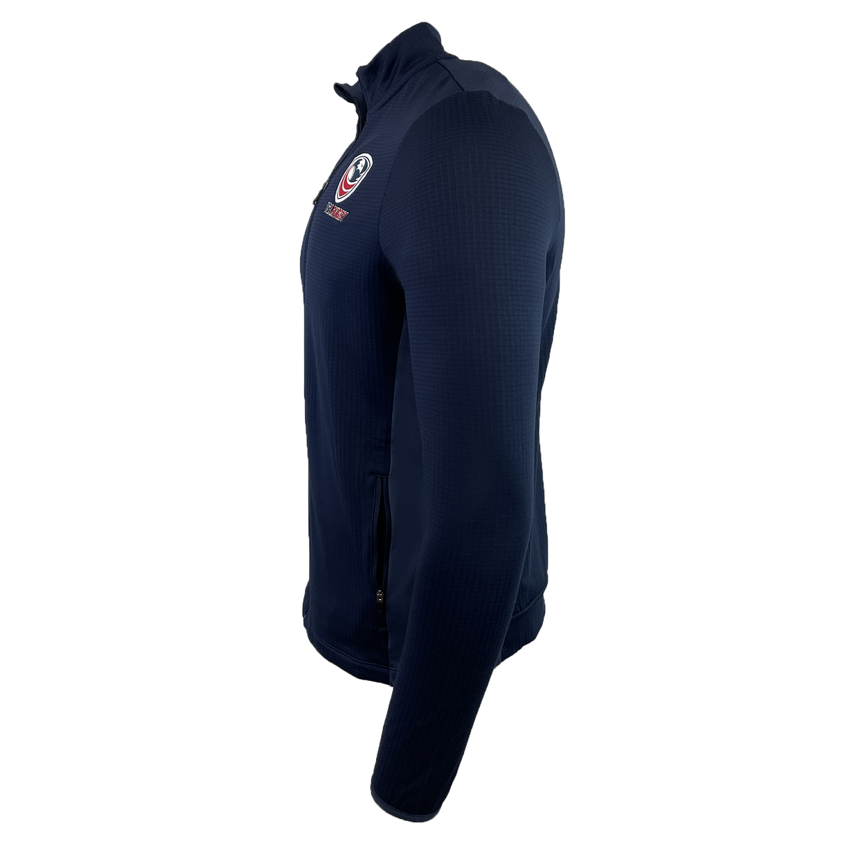 The USA Rugby 25 Travel 3D Full-Zip Top by Macron in navy features a high collar, USA Rugby 25 chest logo, and a zippered side pocket, shown here from the side.