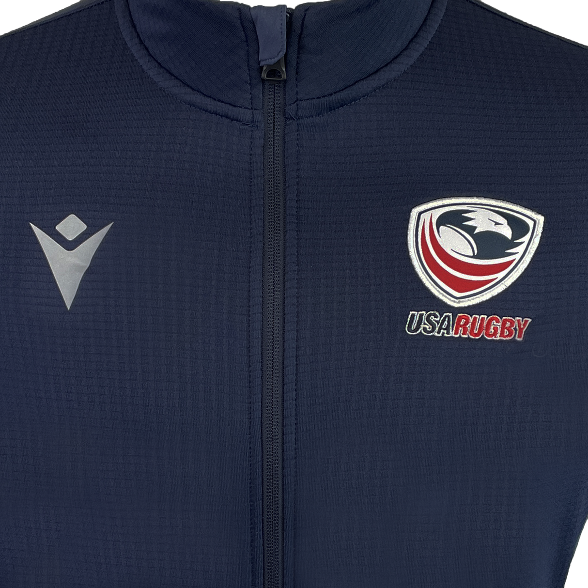 Celebrate USA Rugby 25 in style with the navy USA Rugby 25 Travel 3D Full-Zip Top by Macron, featuring a chest zipper, the USA Rugby eagle logo, and Macron branding.