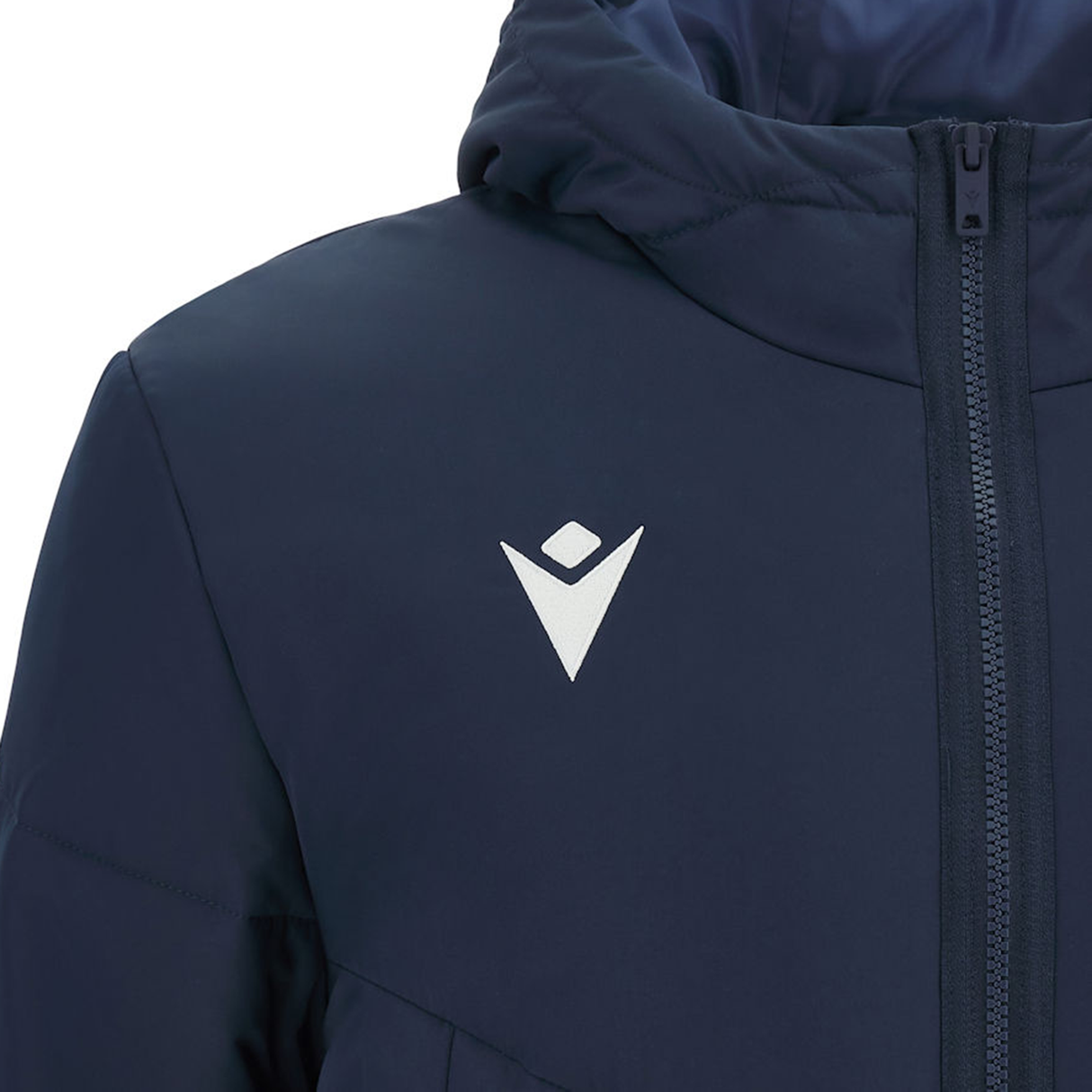 The "USA Rugby 25 Padded Bench Jacket" by Macron is navy blue, has a hood, and features a white geometric logo on the chest. It is crafted from water-resistant fabric and includes a front zipper closure.