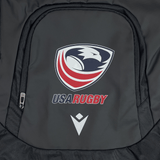 The USA Rugby 25 Gymsack by Macron is a black waterproof bag featuring a stylized eagle, red stripes, "USA Rugby" text, and the Macron logo below.
