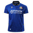 The Italy 25/26 Replica Home Jersey by Macron features blue fabric with black and gold trim, Vittoria Assicurazioni sponsor, team crest, and Macron logo—a must-have official fan jersey for any Italy rugby supporter.