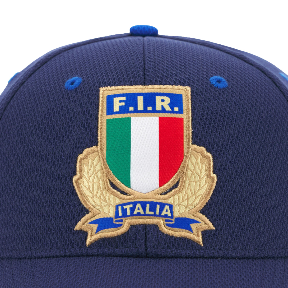 Close-up of the Italy 25/26 Supporters Cap by Macron, featuring the Italian Rugby Federation crest with "F.I.R." and "Italia" above a tricolor shield.