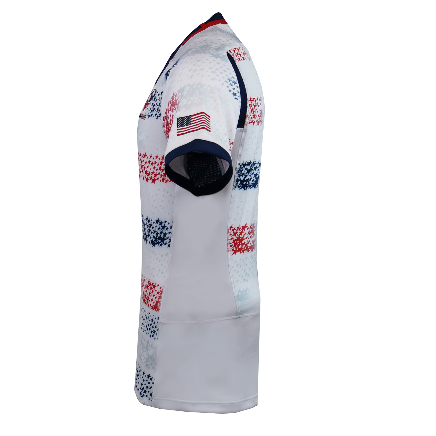 The USA Rugby 25/26 Home Body Fit Match Jersey by Macron is a short-sleeve, body fit shirt with a red, white, and blue pixelated design and an American flag patch on the sleeve, viewed from the left side.