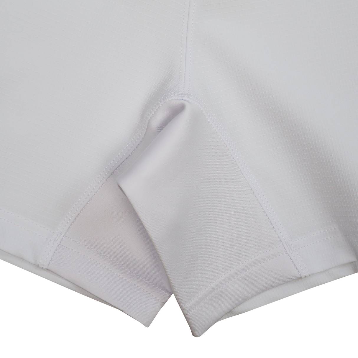 Close-up of the inner seam and gusset area of white USA Rugby 25/26 Home Shorts by Macron, made from smooth, lightweight, breathable fabric for athletic performance.
