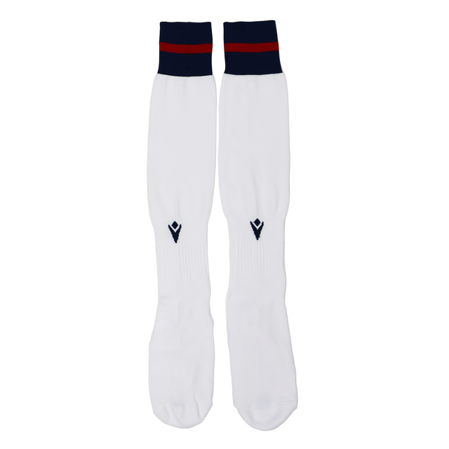 The USA Rugby M25/26 Home Socks by Macron are long white athletic socks made from Renycle yarn, featuring navy blue and red stripes at the top, shown laid flat on a white background.