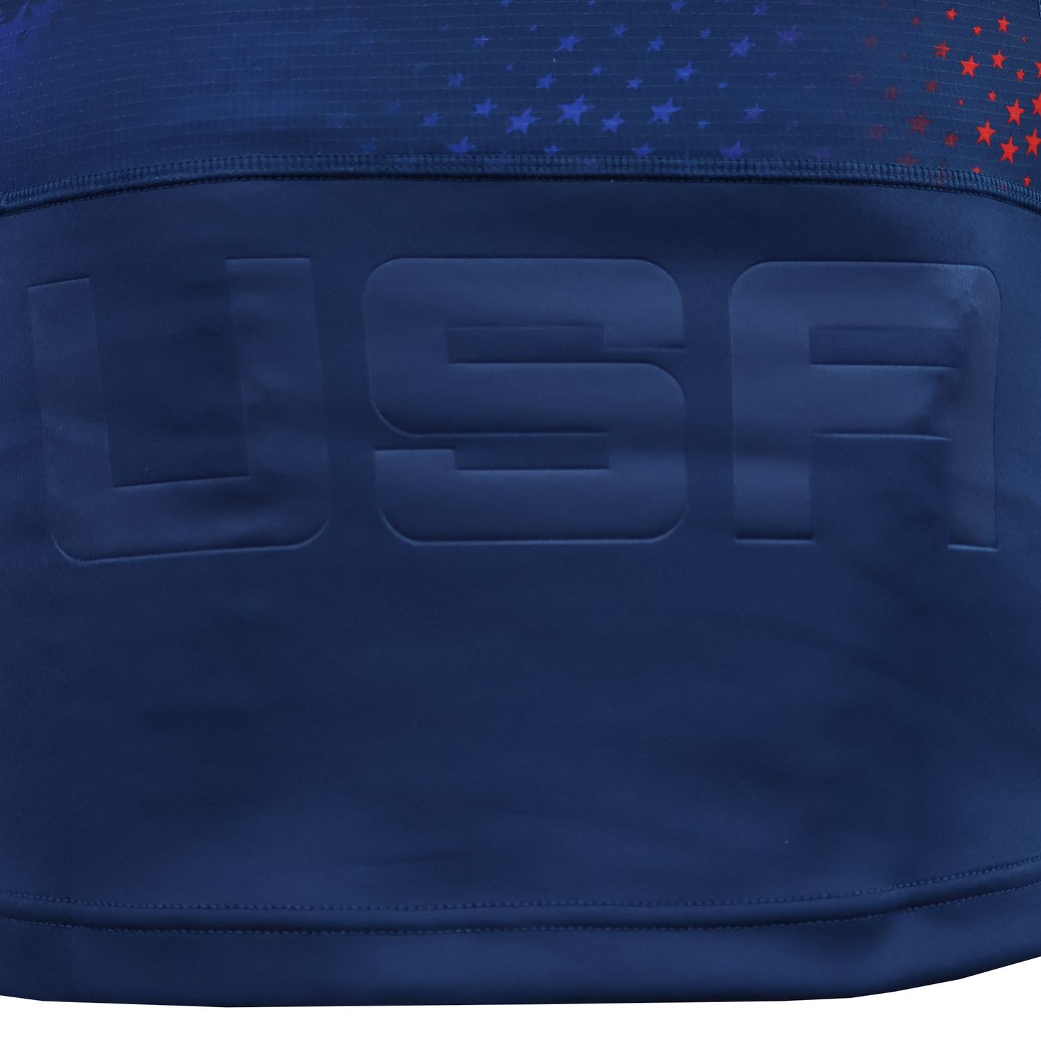 The USA Rugby 25/26 Away Body Fit Match Jersey by Macron features navy blue fabric with "USA" in large letters and a top section decorated with small red and blue stars, reflecting the authentic style of a Macron rugby jersey.