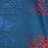 The USA Rugby 25/26 Away Body Fit Match Jersey by Macron features blue fabric with red and blue stars fading from right to left—ideal for high-performance, inspired by classic USA Rugby designs.