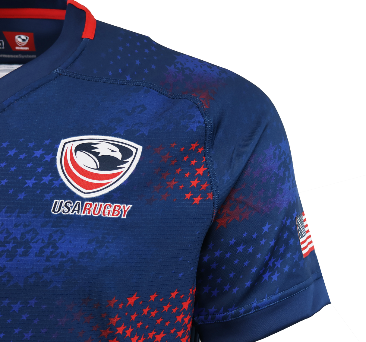 Close-up of the USA Rugby 25/26 Away Body Fit Match Jersey by Macron—blue with team logo, red and white stars, "USA Rugby" text, and an American flag patch on the sleeve; a high-performance jersey for dedicated fans.