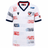 The Youth USA Rugby 25/26 Home Replica Jersey by Macron features red, white, and blue star patterns, a navy collar and sleeve trim, the USA Rugby logo on the chest, and an American flag on the right sleeve—ideal for young fans.