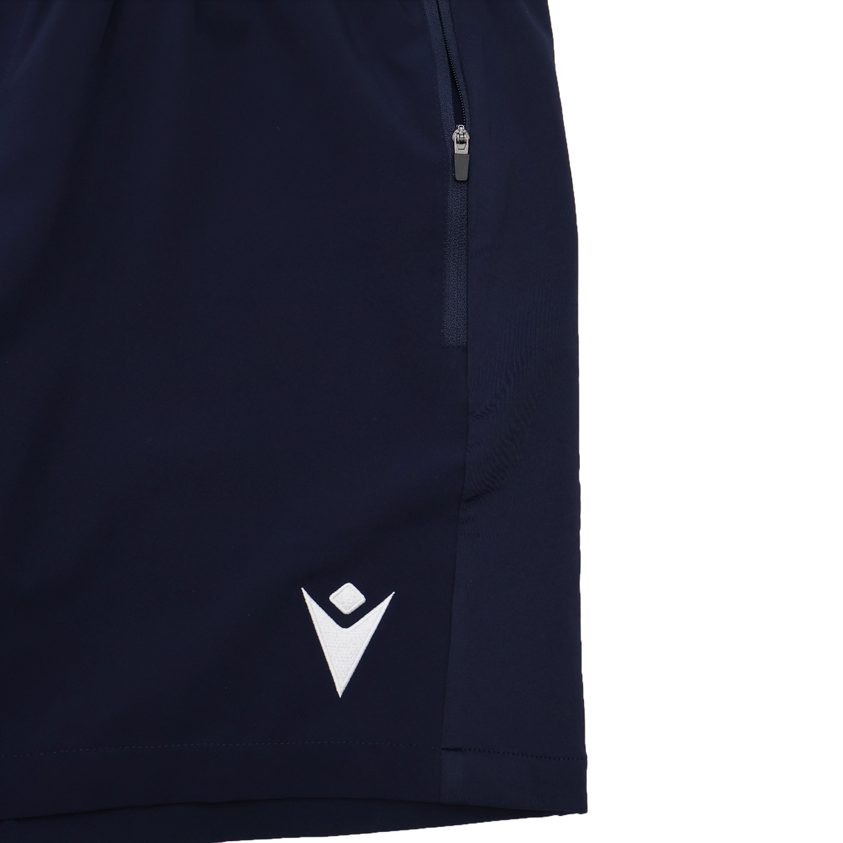 Close-up of the lower part of the USA Rugby 25/26 Training Micro Bermuda shorts by Macron, navy with a white logo and zippered pocket—perfect for training or casual wear.
