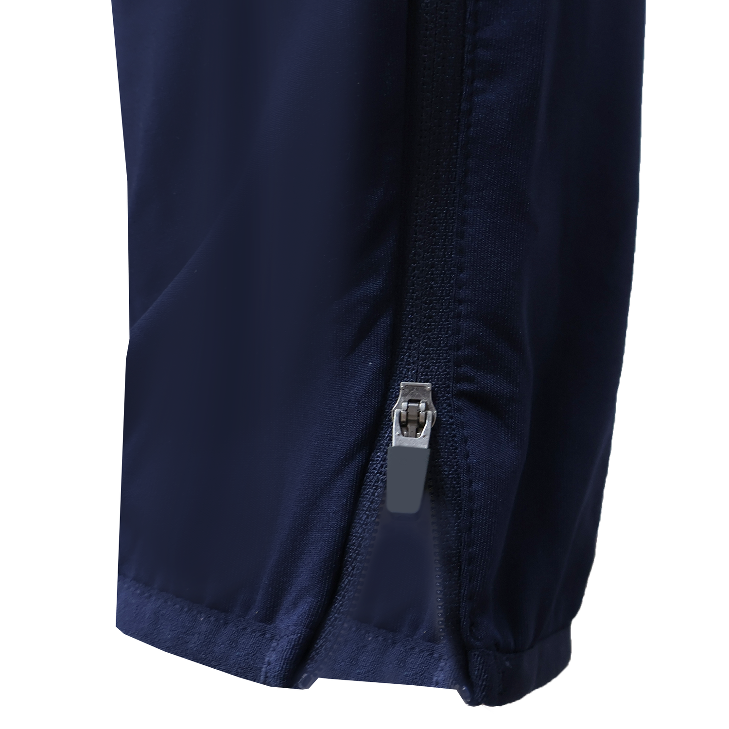Close-up of a USA Rugby 25/26 Training Fitted Pant by Macron in navy blue, featuring a partially opened vertical zipper near the hem.