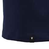 Close-up of the lower part of the USA Rugby 25/26 Athleisure Cotton Polo by Macron in navy blue, showing a small black tag with a white logo near the hem.