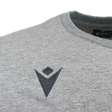 Close-up of the USA Rugby 25/26 Player Travel Sweatshirt by Macron in heather gray, featuring a crew neck and a small, embroidered dark gray geometric logo on the chest.