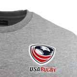 Close-up of the USA Rugby 25/26 Player Travel Sweatshirt by Macron in gray, featuring the official logo and "USA Rugby" embroidery. Perfect for fans and athletes as a stylish player travel sweatshirt.