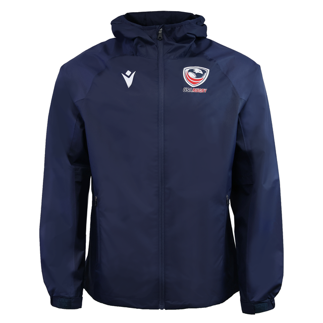 USA Rugby 25/26 Rain Jacket by Macron in navy blue, with a hood, USA Rugby team logo on the right chest, and white Macron logo on the left chest. Brand: Macron. Displayed on a plain background.