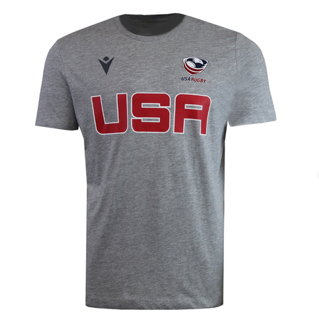 The USA Rugby M25/26 Leisure Shirt by Macron features "USA" in bold red on the front, with the USA Rugby logo and USAR M25/26 marking above it on the left chest.