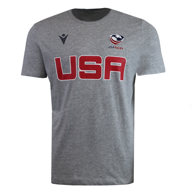The USA Rugby M25/26 Leisure Shirt by Macron features "USA" in bold red on the front, with the USA Rugby logo and USAR M25/26 marking above it on the left chest.