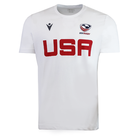 The USA Rugby M25/26 Leisure Shirt by Macron is a white short-sleeve shirt with "USA" in bold red, the USA Rugby logo on the right, and a black Macron logo on the left.