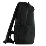 The USA Rugby 25/26 Staff Backpack by Macron is shown from the side in black, featuring multiple zippered compartments and padded shoulder straps.