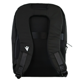 The USA Rugby 25/26 Staff Backpack by Macron is shown from the back, with padded shoulder straps, a chest strap, and a small white geometric logo on the left strap.