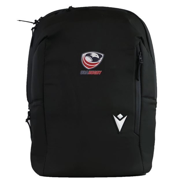 The USA Rugby 25/26 Staff Backpack by Macron is a black ergonomic backpack with the USA Rugby and Macron logos on the front, shown against a white background.