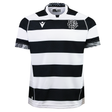 The Barbarians 25/26 Replica Home Jersey by Macron features black and white horizontal stripes, short sleeves, a team logo on the left chest, and patterned sleeve cuffs.