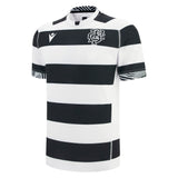 The Barbarians 25/26 Replica Home Jersey by Macron is a short-sleeved, black and white striped rugby jersey with a crew neck and Macron logos on the chest and sleeves.