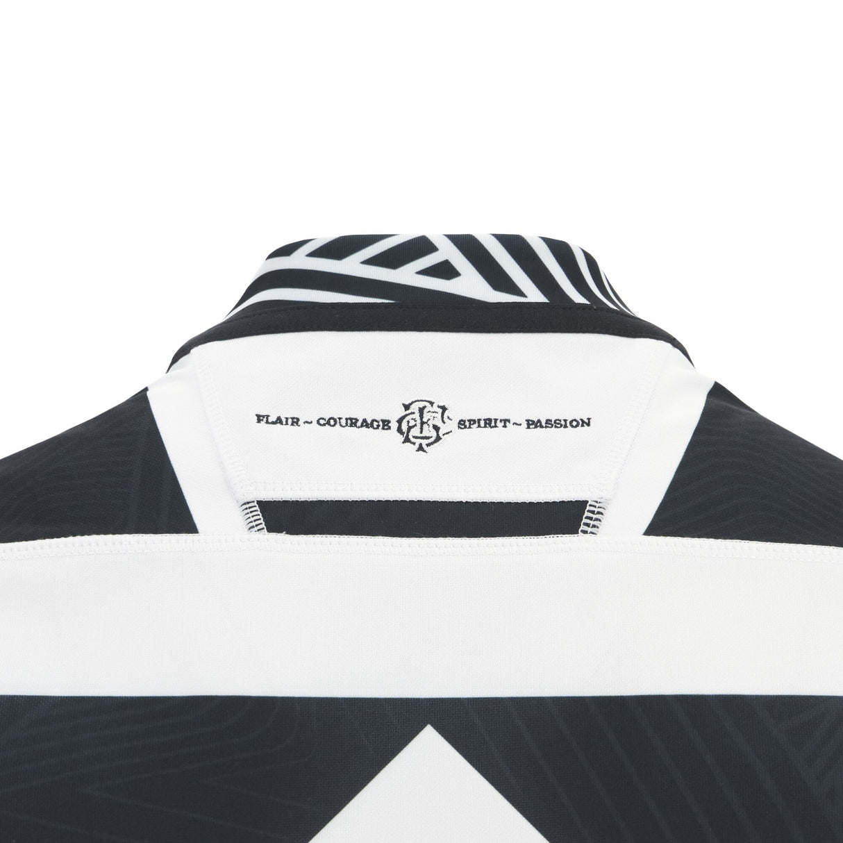 Close-up of the back collar on the Barbarians 25/26 Replica Home Jersey by Macron, showing “FLAIR • COURAGE • SPIRIT • PASSION” text and a small logo beneath the neckline.