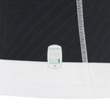 Close-up of the Barbarians 25/26 Replica Home Jersey by Macron, featuring visible stitching and a “Macron official licensed product eco fabric” label that highlights the quality details of this authentic jersey.