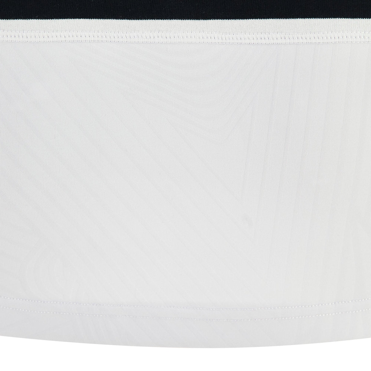 A close-up of the Barbarians 25/26 Cotton Long Sleeve Home Jersey by Macron shows a black upper band, white middle band, and visible stitching on the bottom edge.